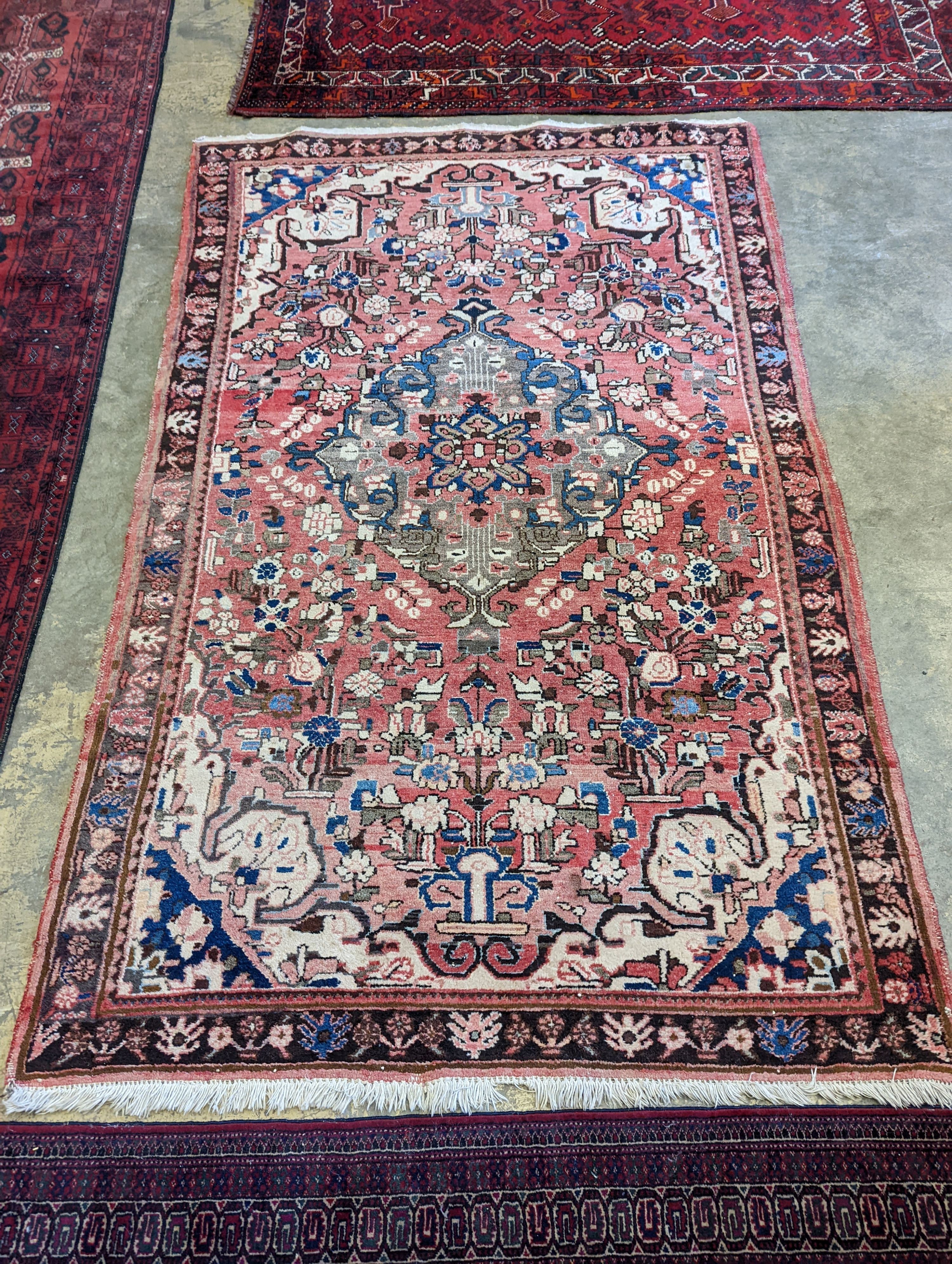 A North West Persian peach ground rug, 240 x 140cm